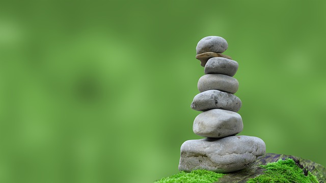 rocks balancing with green nature background