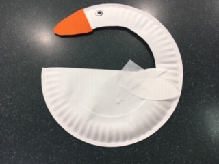 white paper plate swan with curved neck and orange beak