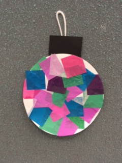 round holiday ornament with tissue paper mosaic