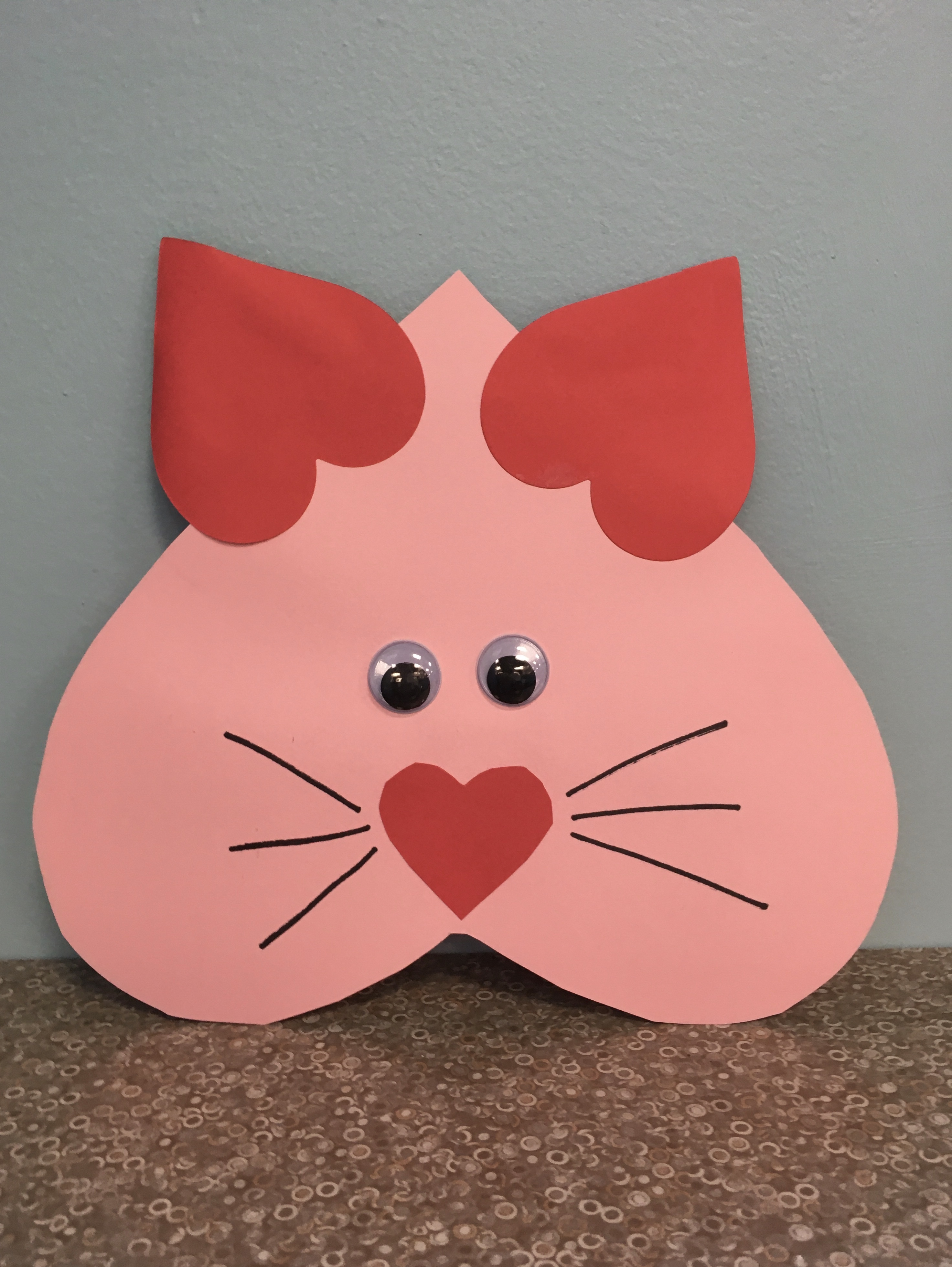 heart-shaped cat face with red heart ears and nose, wiggle eyes and whiskers