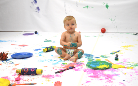 baby with paint