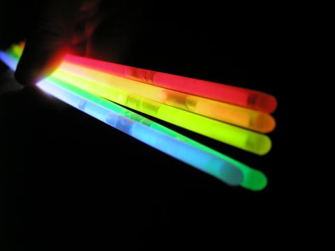 image of red, orange, yellow and blue glow sticks.